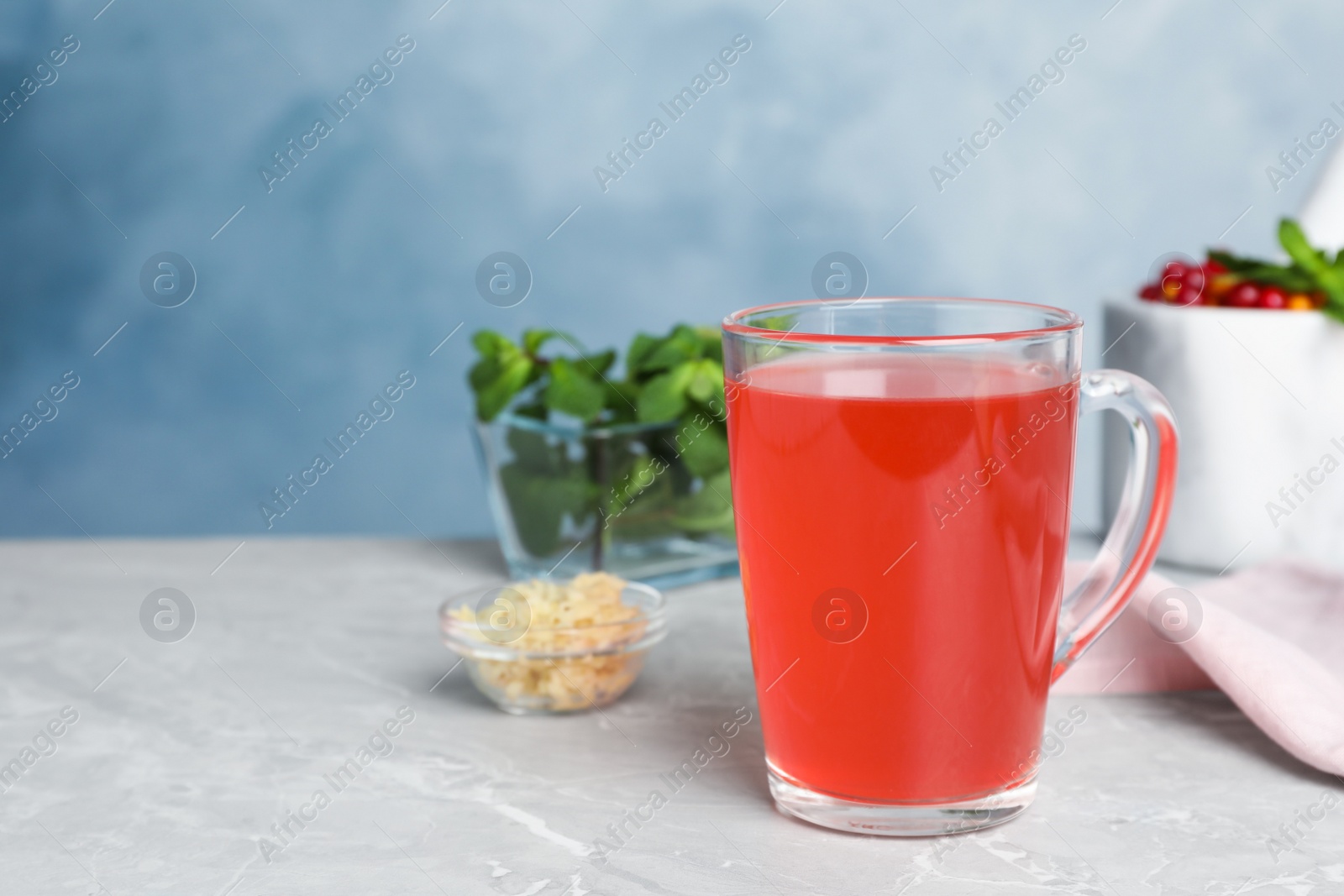Photo of Immunity boosting drink on light grey marble table. Space for text