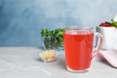 Photo of Immunity boosting drink on light grey marble table. Space for text