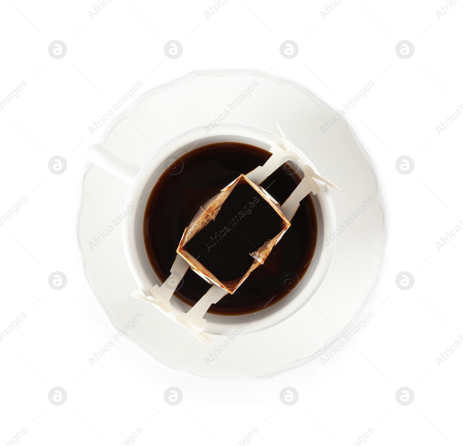 Photo of Cup with drip coffee bag isolated on white, top view