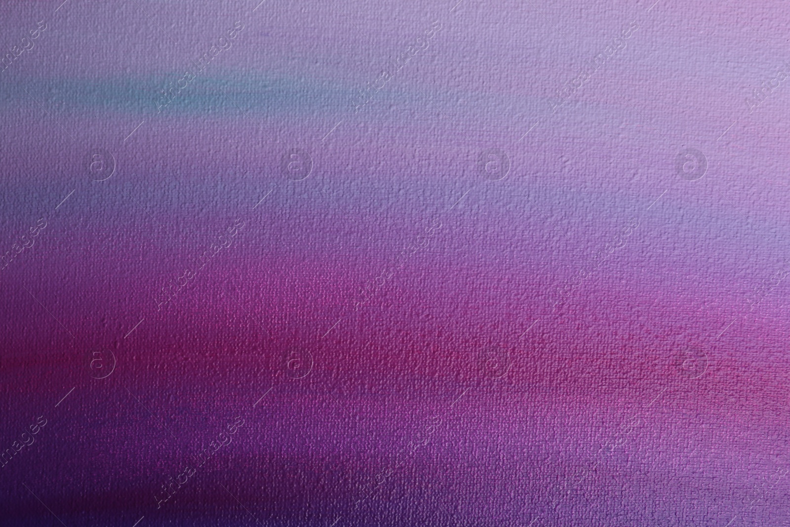 Photo of Canvas with colorful gradient painting, closeup view