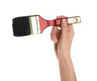 Woman holding paint brush on white background, closeup