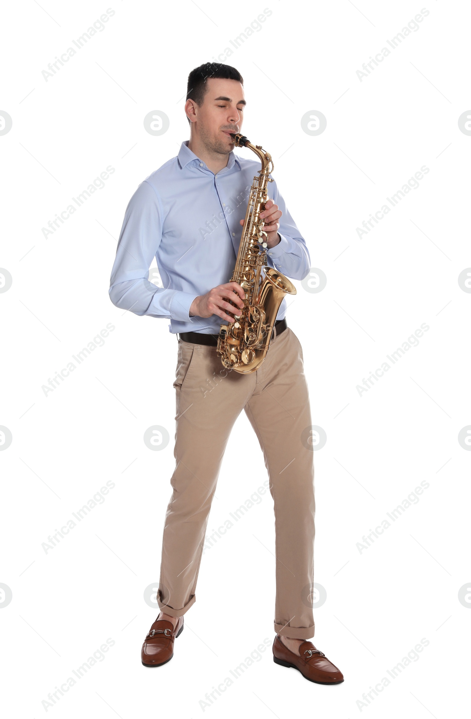 Photo of Young man playing saxophone on white background