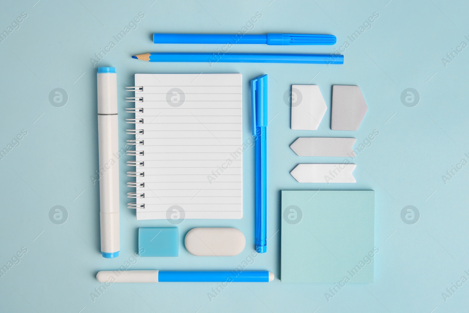 Photo of Different school stationery on light blue background, flat lay with space for text. Back to school