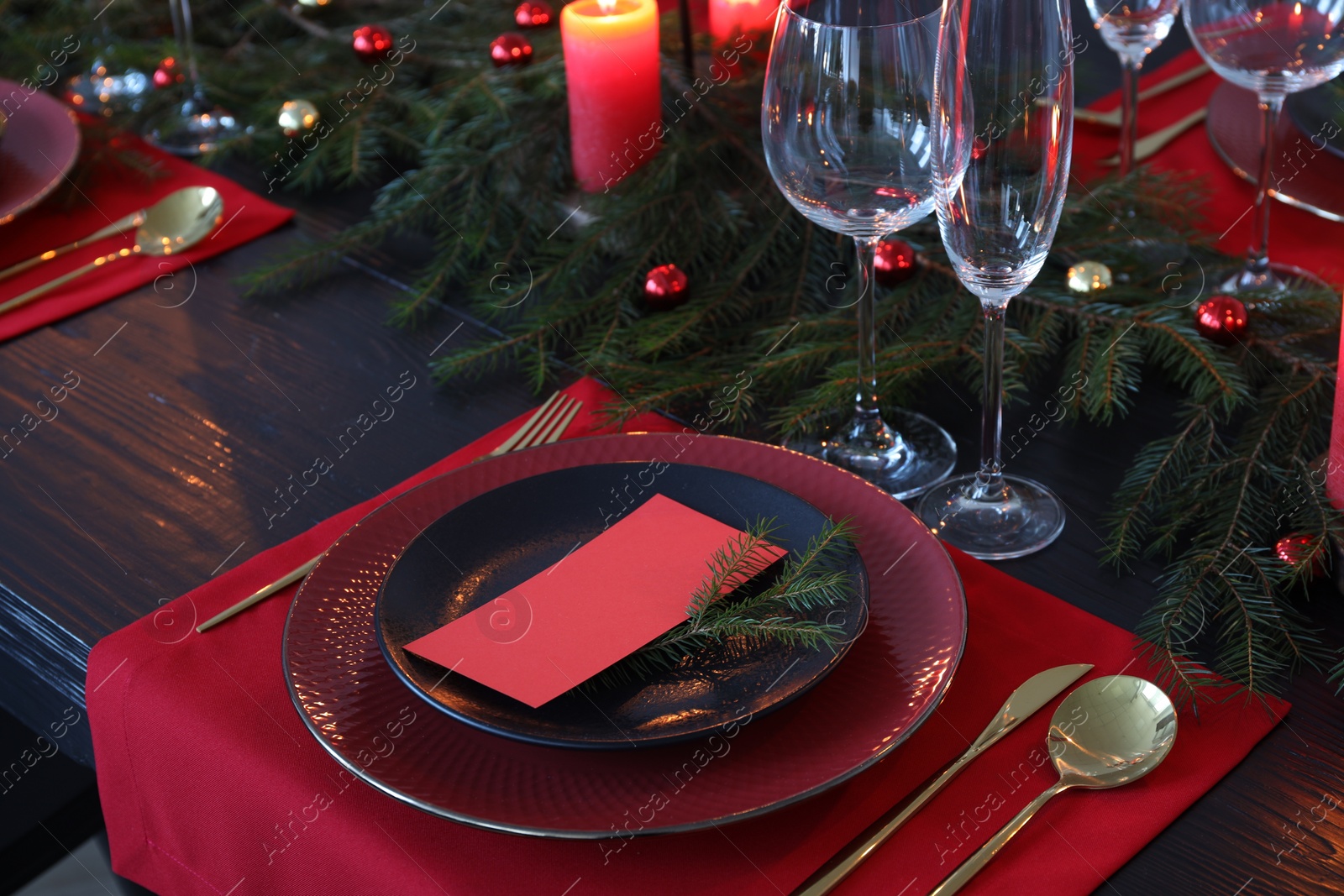 Photo of Elegant Christmas table setting with blank place card and festive decor