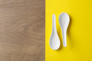 Photo of Miso soup spoons on table, flat lay. Space for text