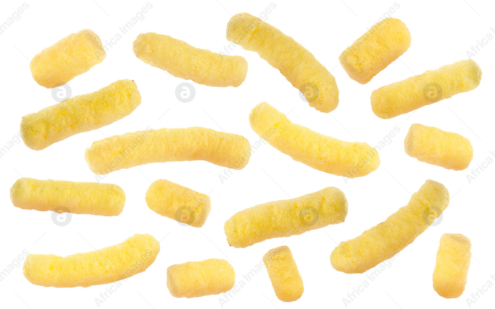 Image of Many tasty corn sticks falling on white background