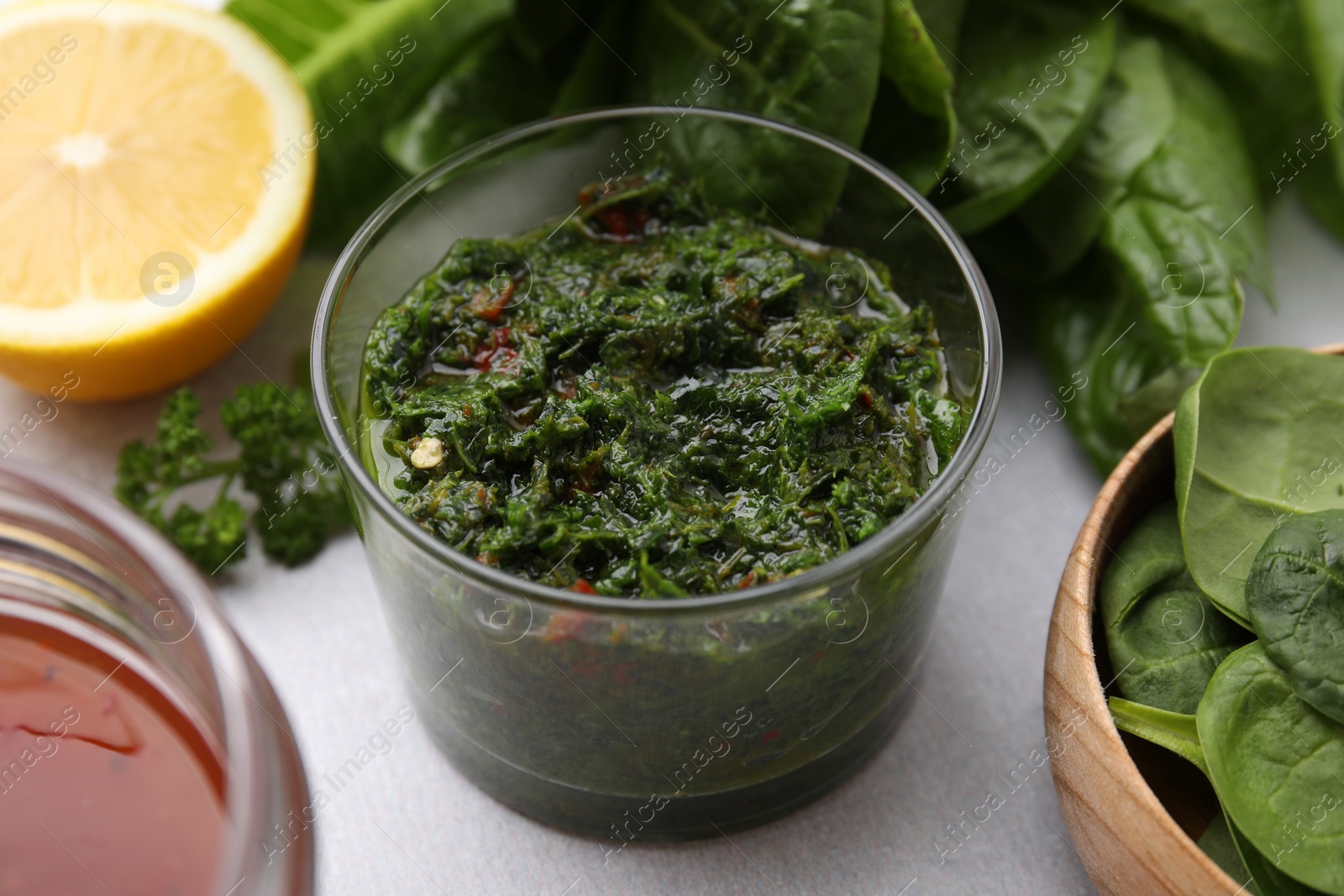 Photo of Fresh homemade marinade in bowl on table, closeup