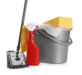 Photo of Plastic bucket with foam and cleaning supplies on white background