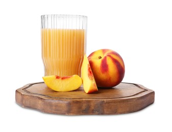 Glass of delicious juice, whole and cut peaches isolated on white