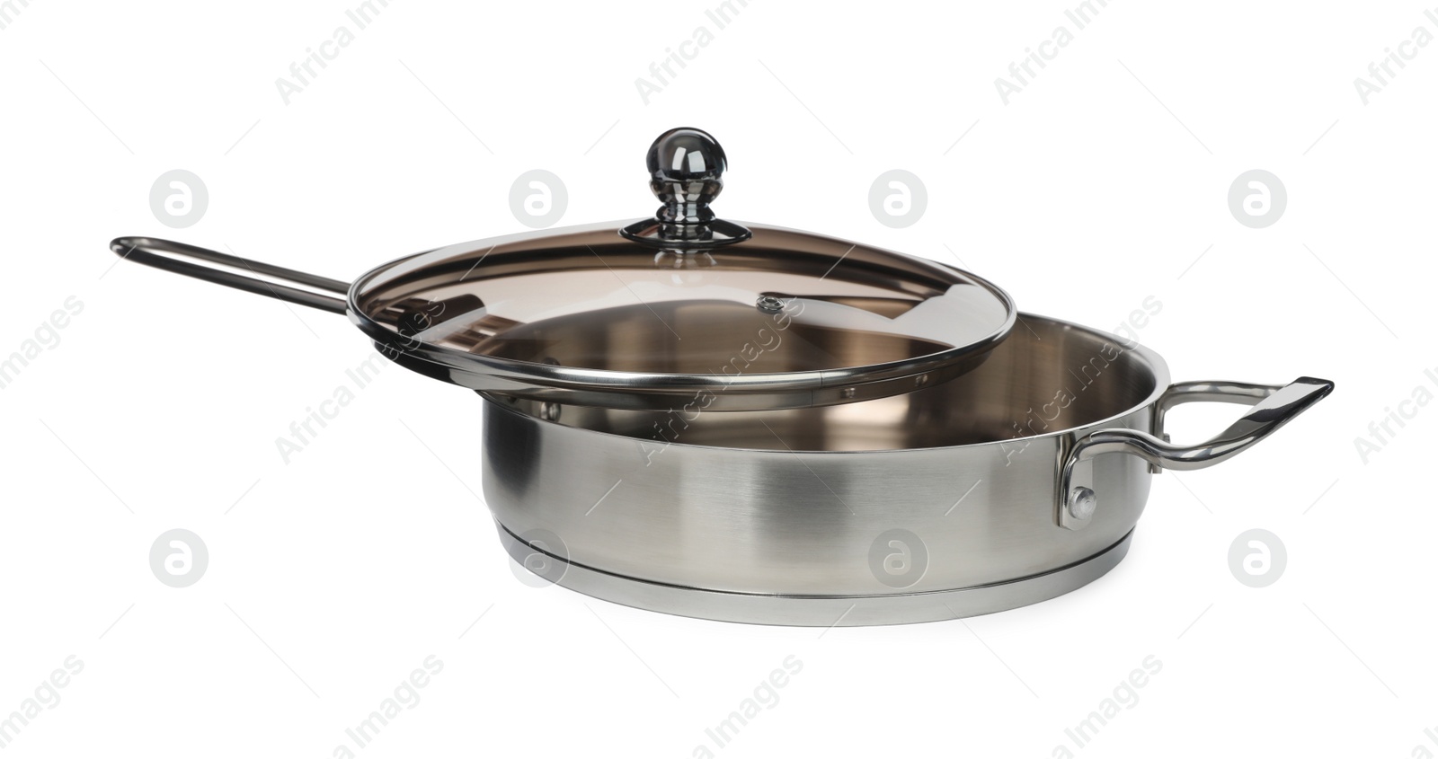 Photo of New stainless steel frying pan with glass lid isolated on white