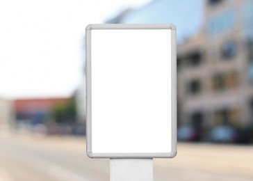 Image of Blank advertising board outdoors on sunny day. Mockup for design