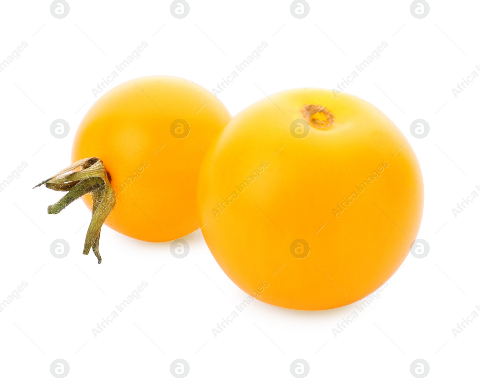 Photo of Delicious ripe yellow cherry tomatoes on white background