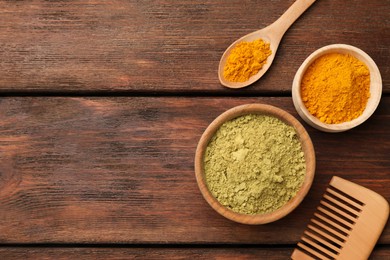 Photo of Comb, henna and turmeric powder on wooden table, flat lay. Space for text