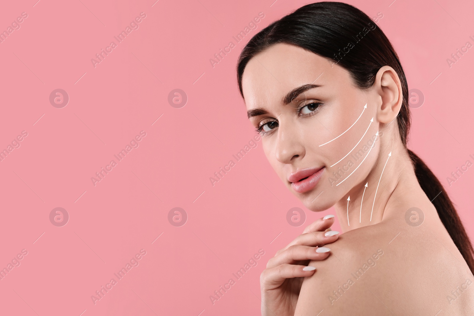 Image of Attractive woman with perfect skin after cosmetic treatment on pink background, space for text. Lifting arrows on her face