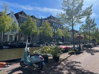 Leiden, Netherlands - August 03, 2022: View of city street with buildings along canal