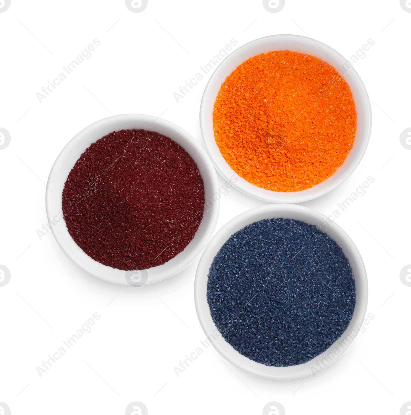 Photo of Bowls with food coloring on white background, top view