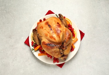 Delicious cooked turkey served on light table, flat lay. Thanksgiving Day celebration