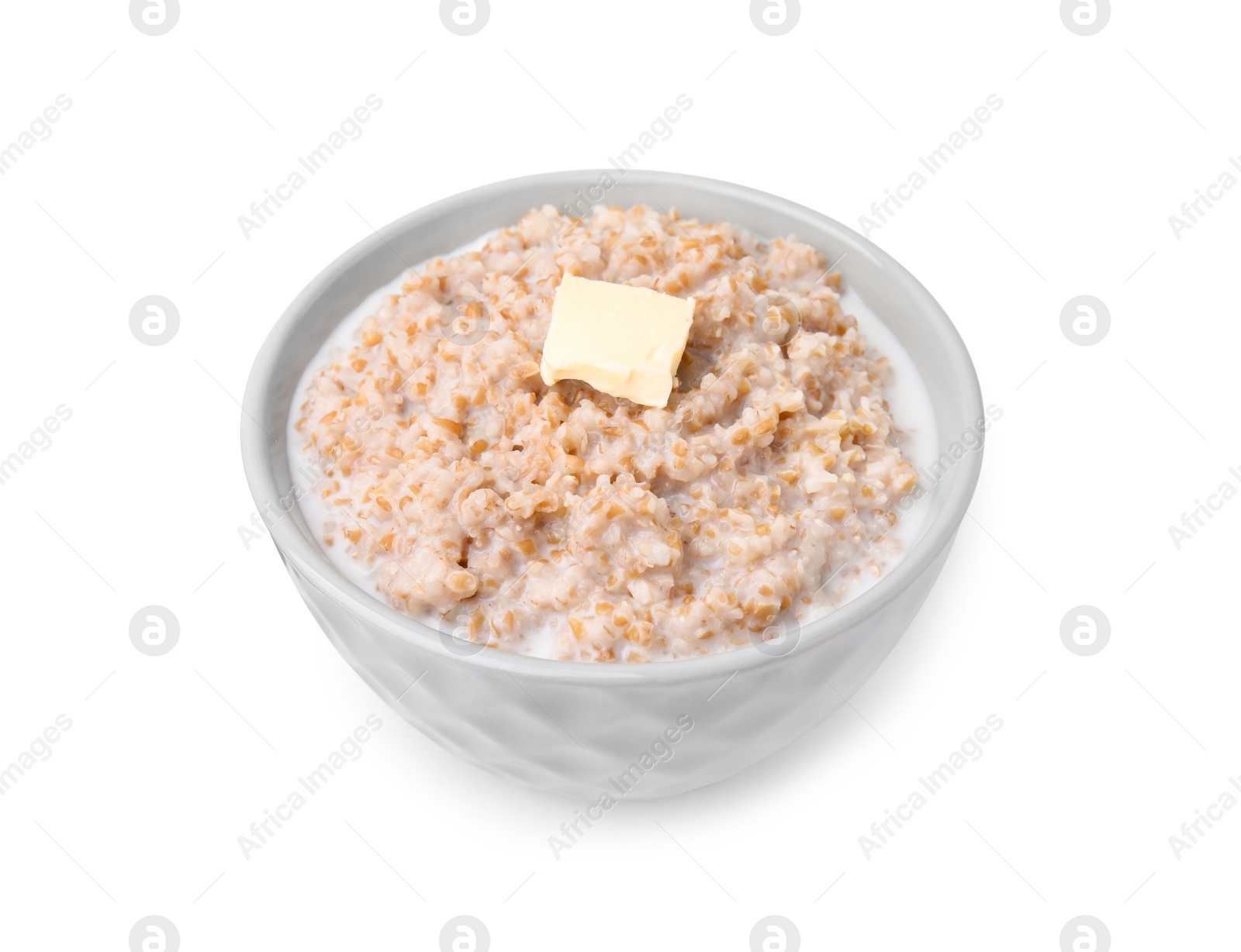 Tasty wheat porridge with milk and butter in bowl isolated on white Photo of Tasty wheat porridge with milk and butter in bowl isolated on white