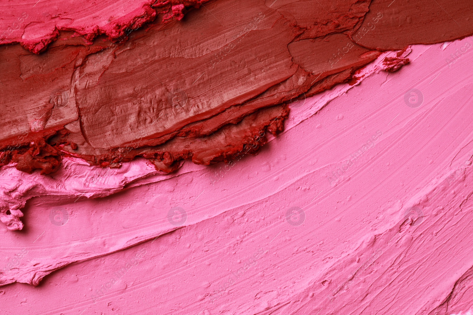 Photo of Texture of beautiful lipsticks as background, top view