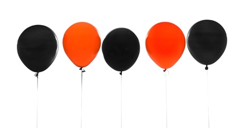 Photo of Colorful balloons on white background. Halloween party