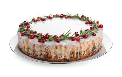 Photo of Traditional Christmas cake decorated with rosemary and cranberries isolated on white