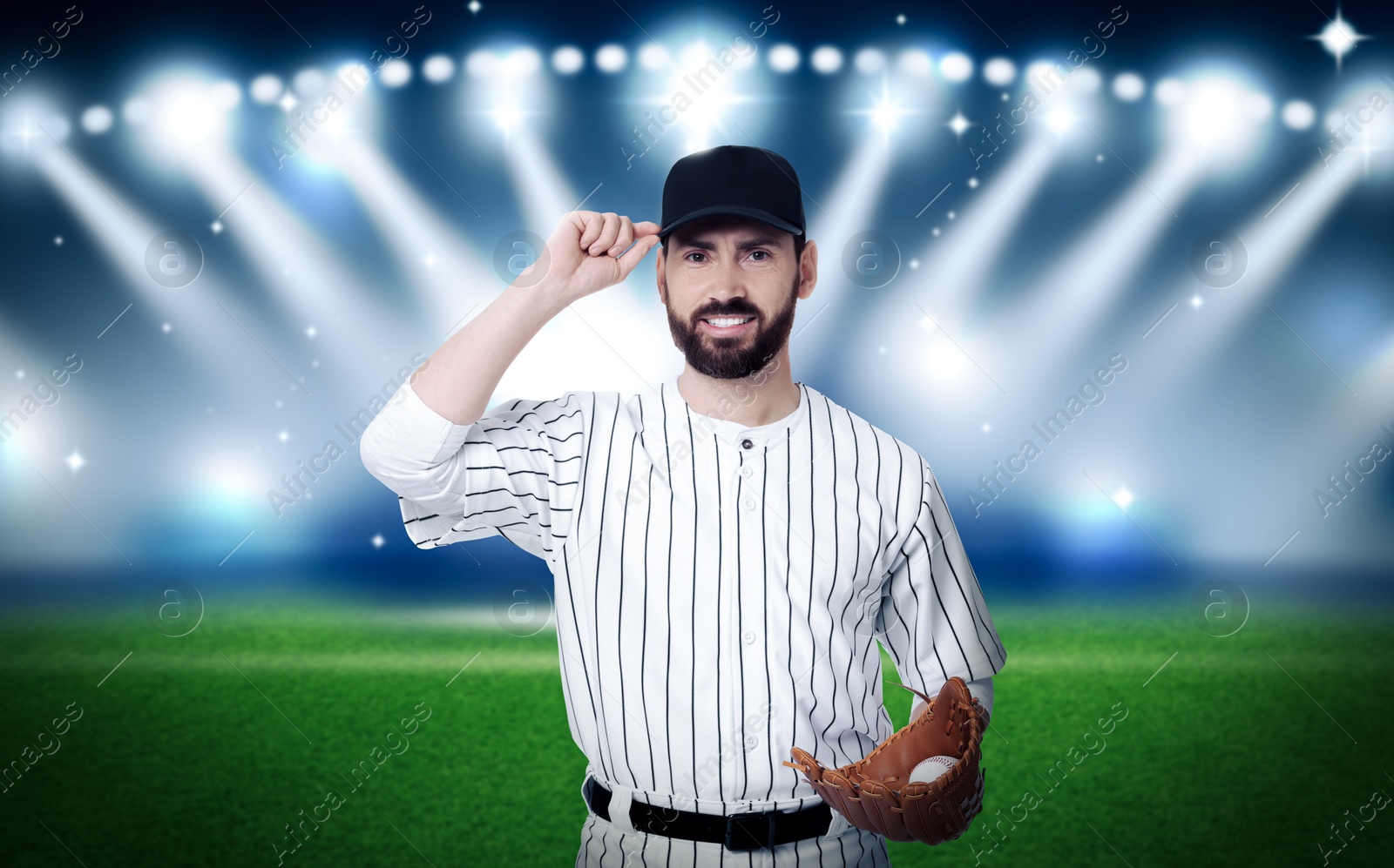 Image of Professional baseball player with glove and ball on stadium