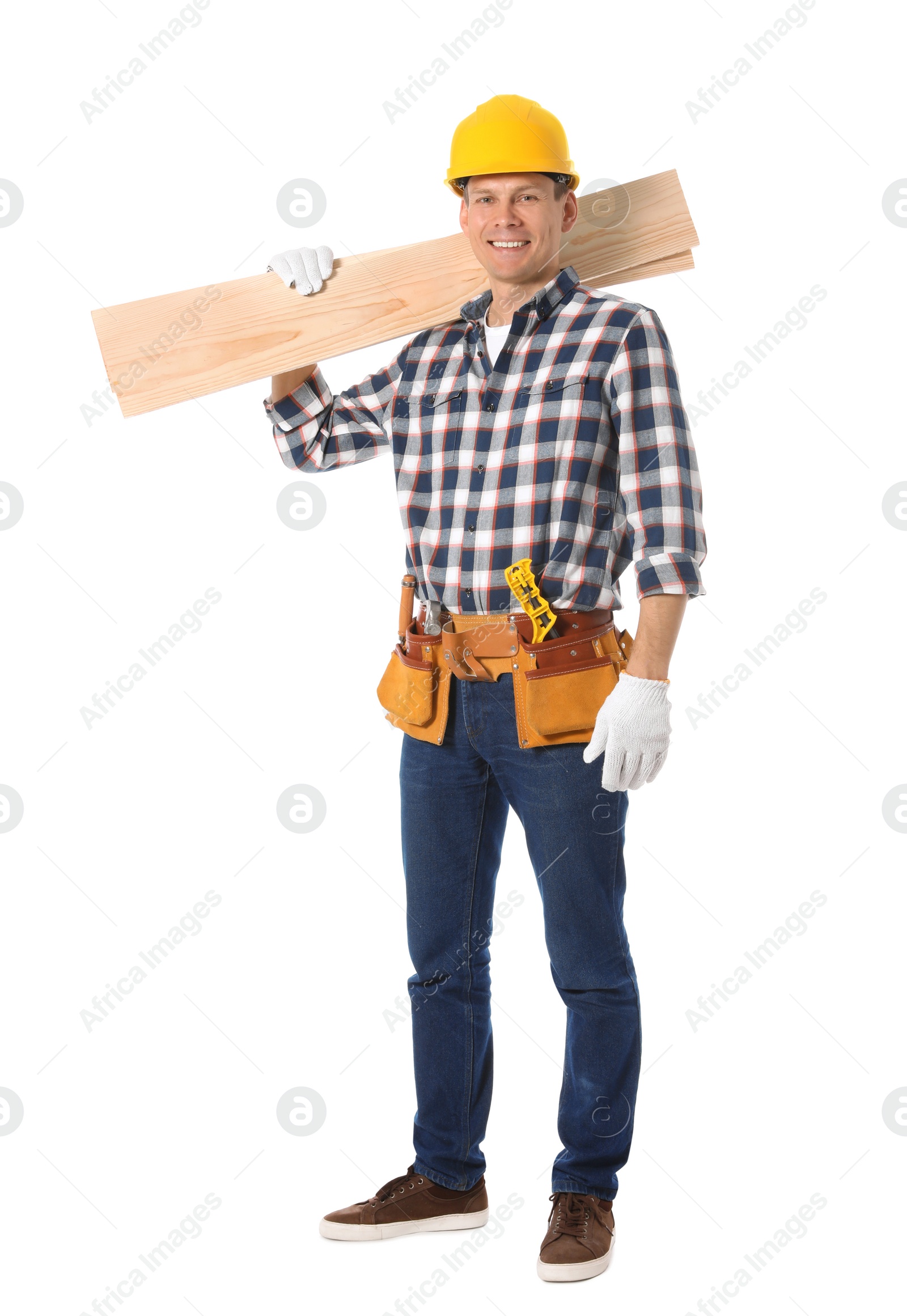 Photo of Handsome carpenter with wooden planks isolated on white