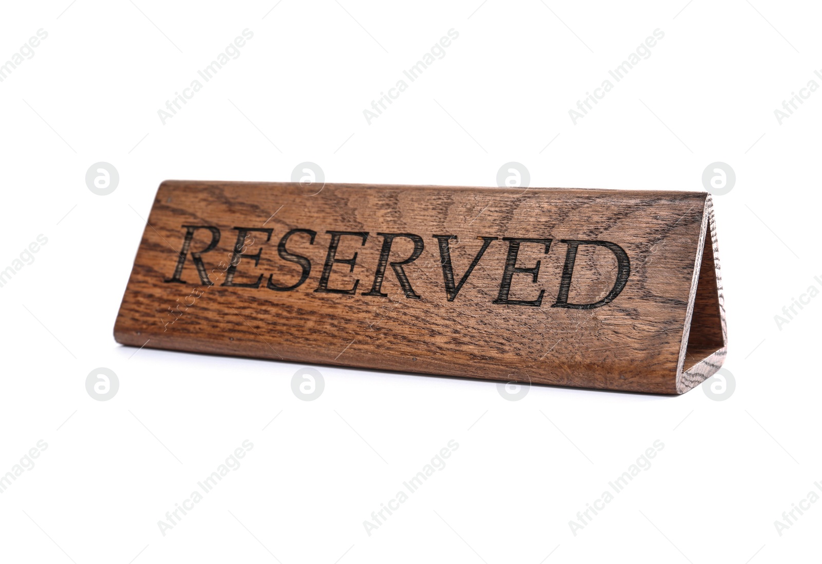 Photo of Elegant wooden sign RESERVED on white background. Table setting element