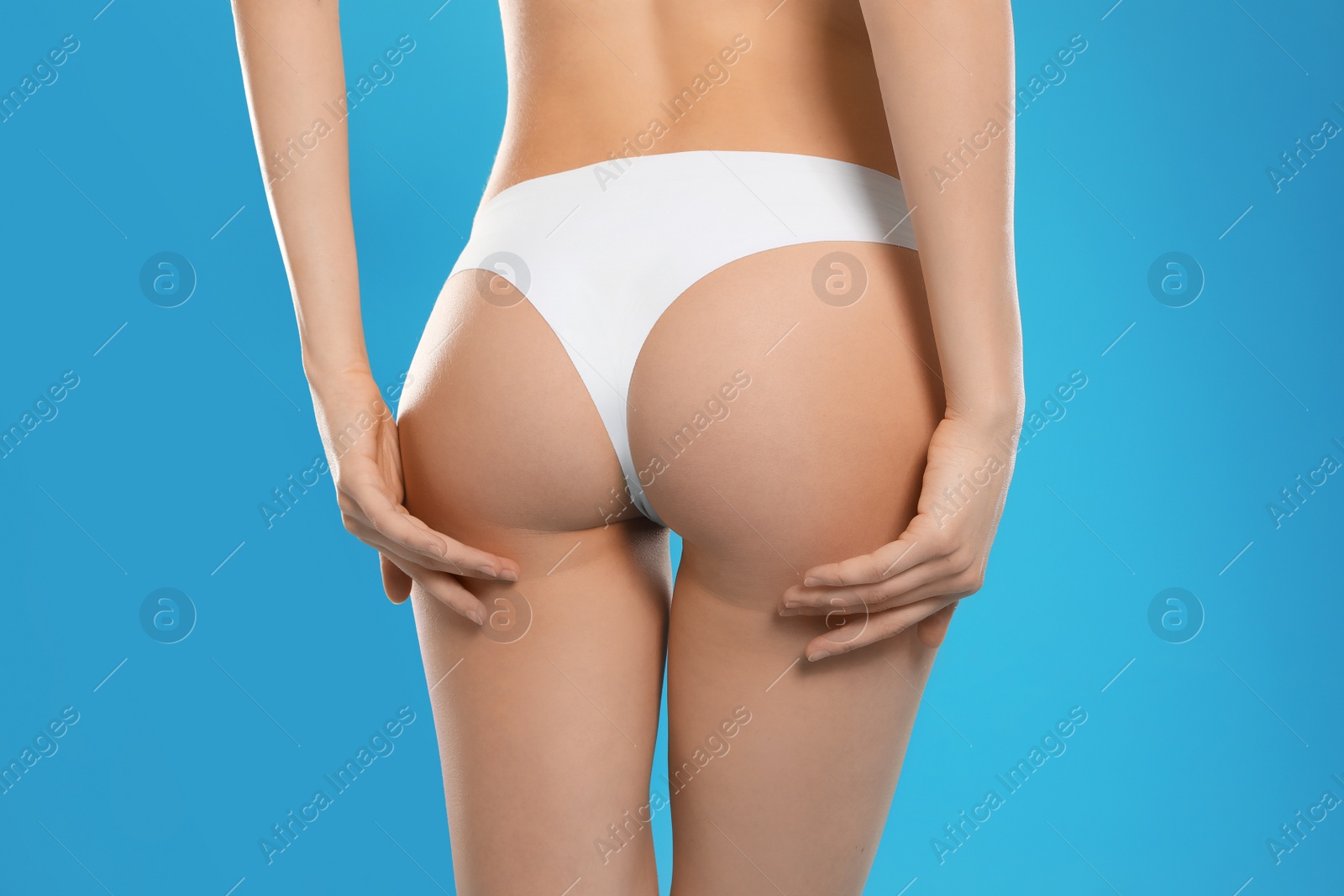 Photo of Slim young woman with smooth gentle skin on color background, closeup. Beauty and body care concept