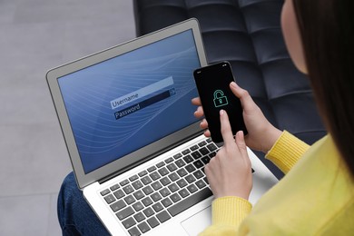 Woman unlocking smartphone with blocked screen near laptop indoors, closeup