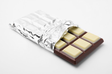 Photo of One tasty chocolate bar on white background