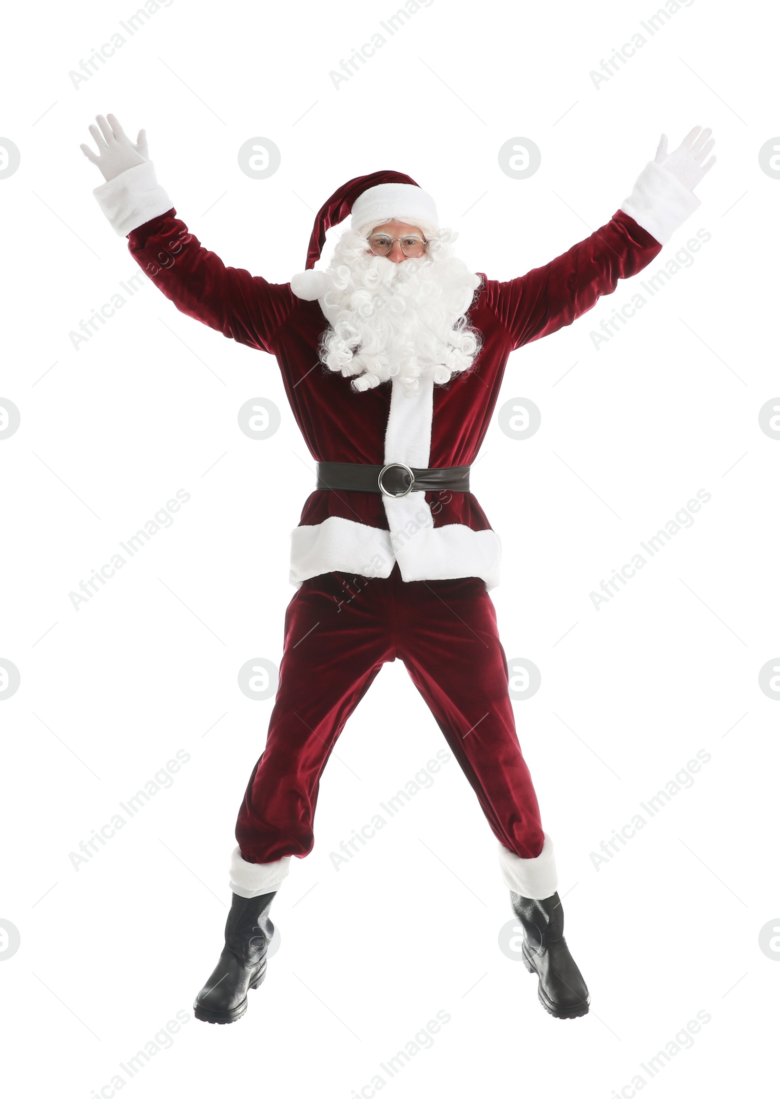 Photo of Santa Claus in red costume jumping on white background