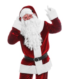 Photo of Santa Claus with headphones listening to Christmas music on white background