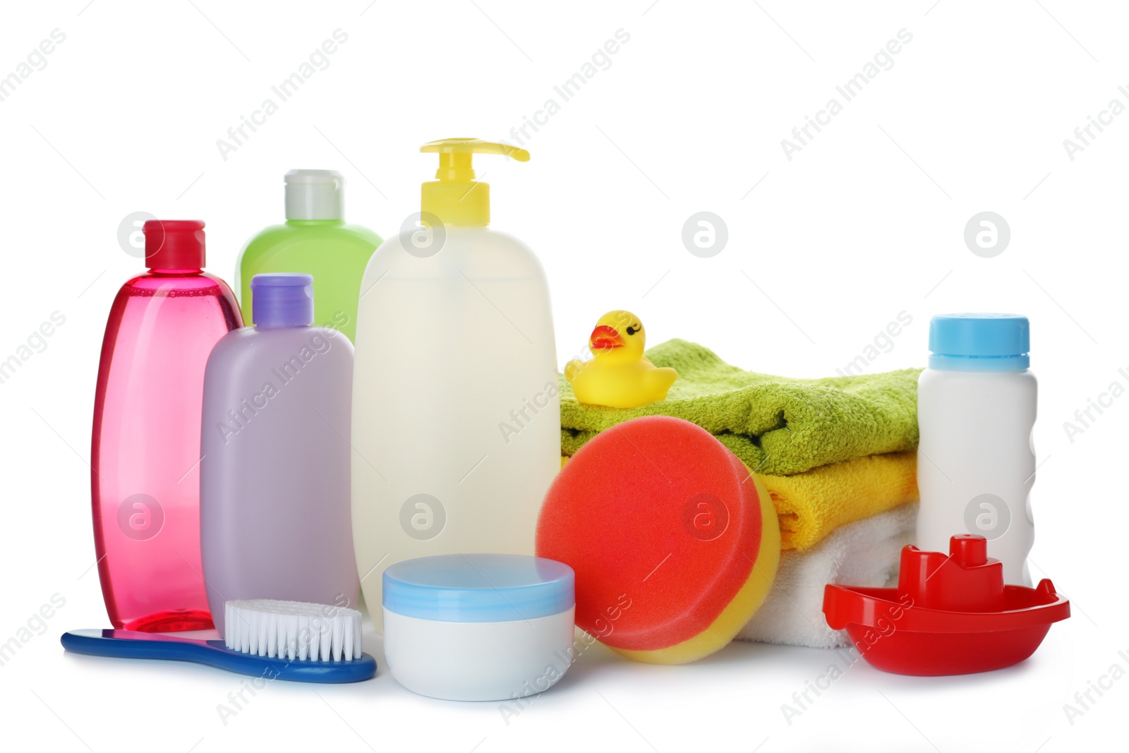 Photo of Baby cosmetic products, toys and towels on white background