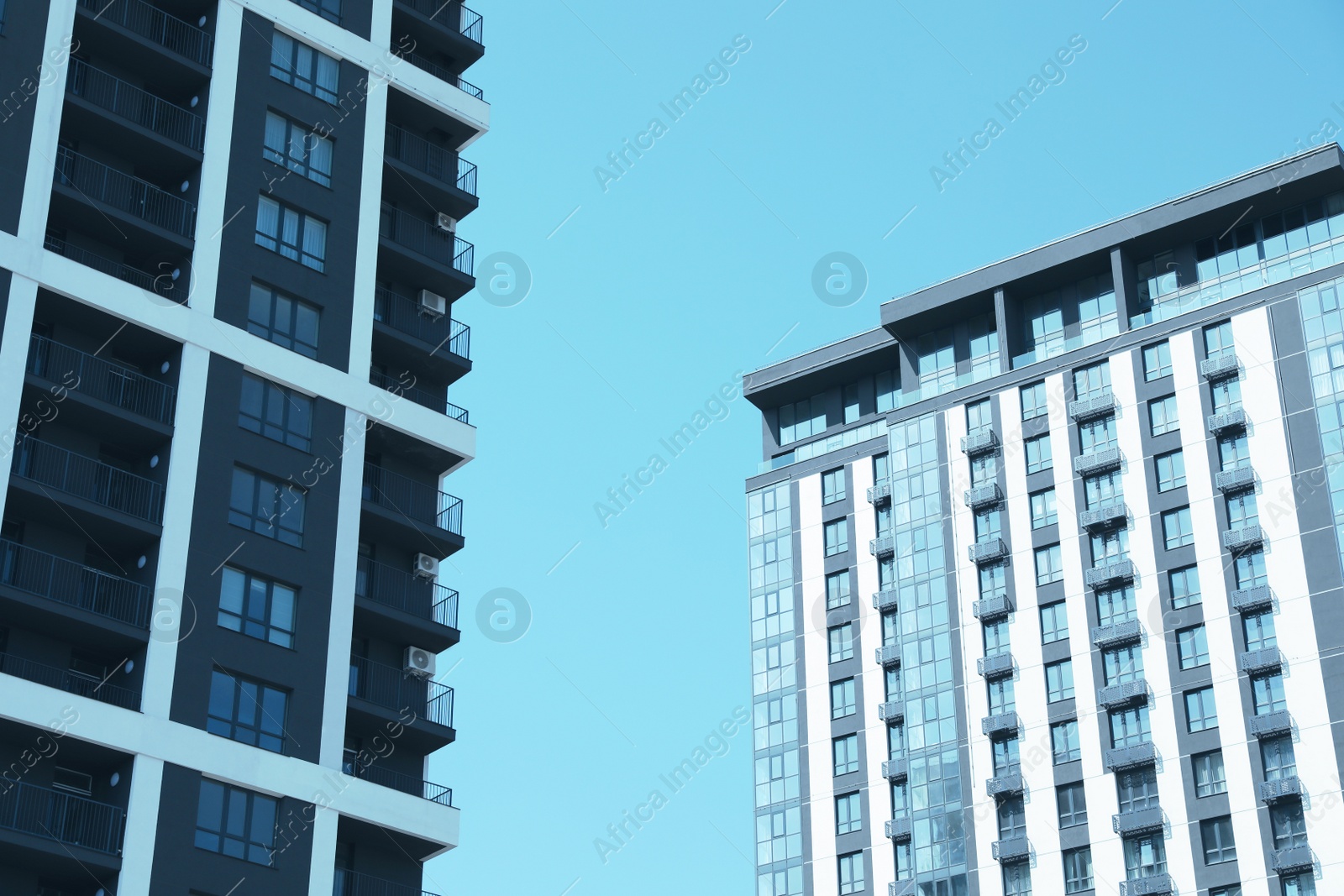 Photo of View of modern buildings against blue sky