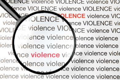 Word VIOLENCE under magnifying glass on white background, top view