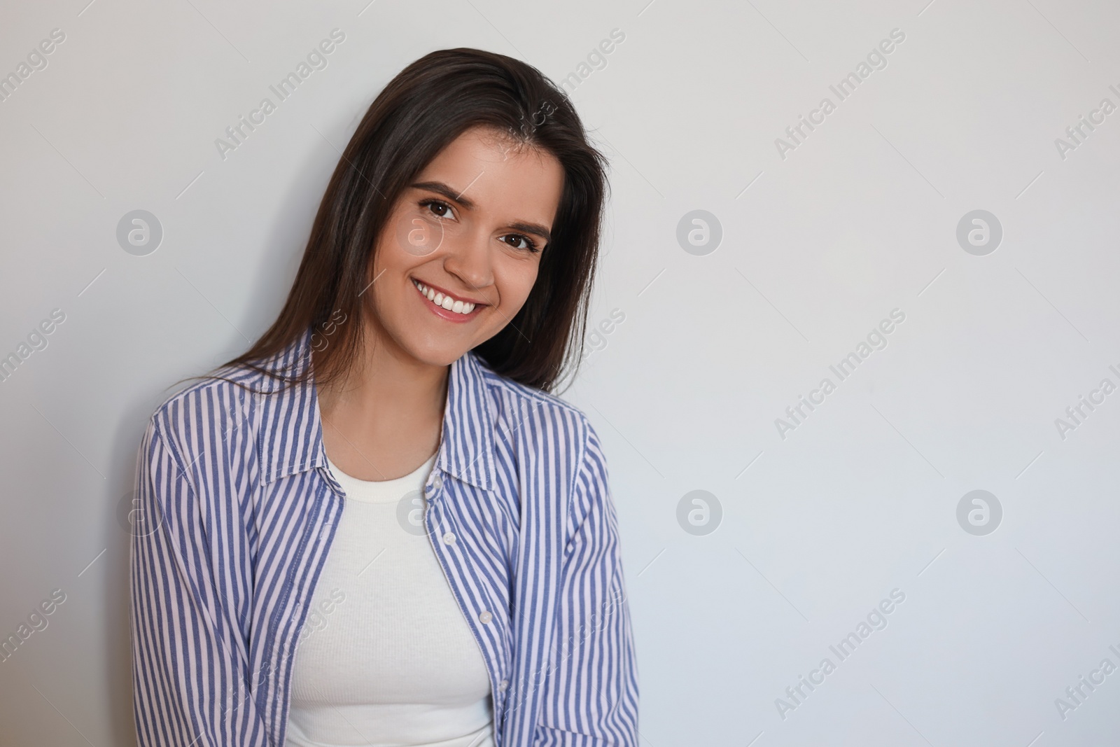 Photo of Portrait of beautiful young woman on white background, space for text