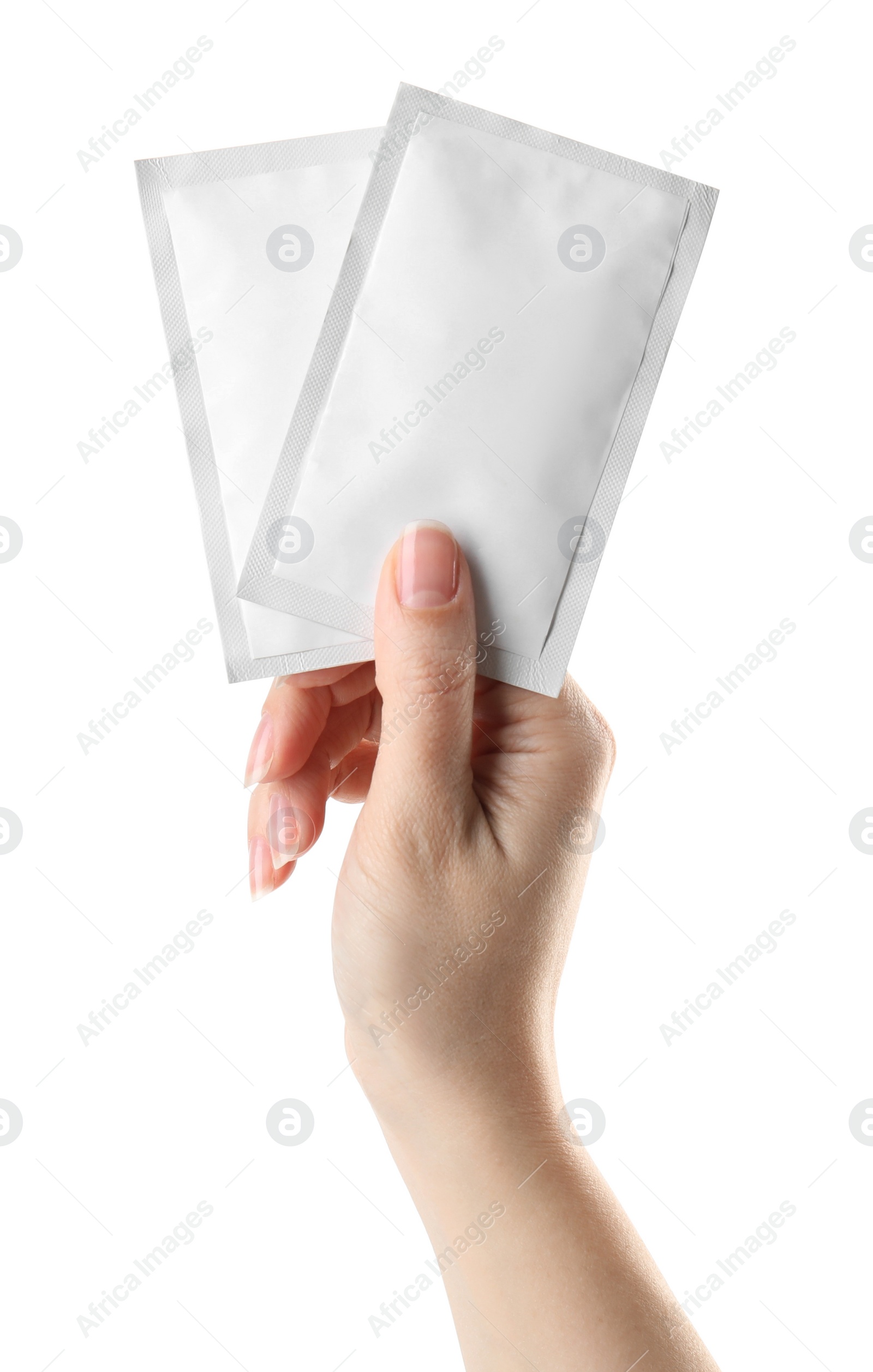 Photo of Woman holding medicine sachets on white background, closeup