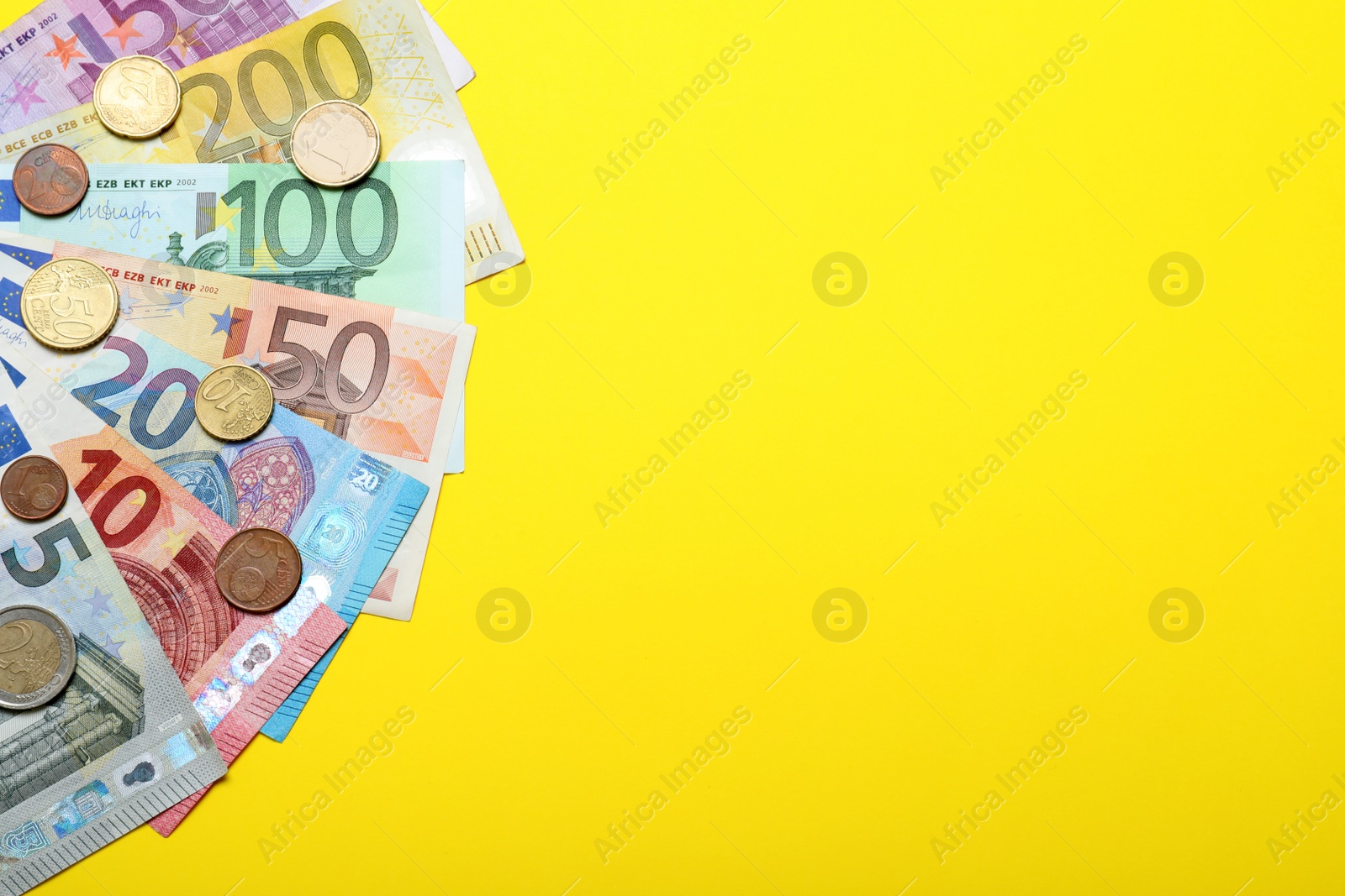 Image of Money on yellow background, flat lay. Space for text 