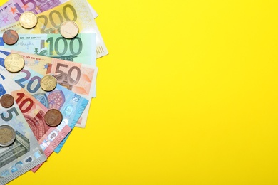 Image of Money on yellow background, flat lay. Space for text 