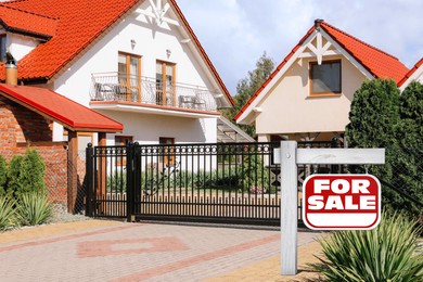 Image of Red sign with words For Sale near beautiful house outdoors