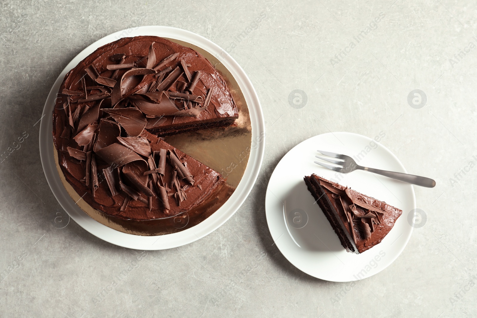 Photo of Flat lay composition with tasty chocolate cake on table