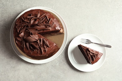 Flat lay composition with tasty chocolate cake on table