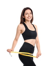 Photo of Happy young woman with measuring tape showing her slim body against white background