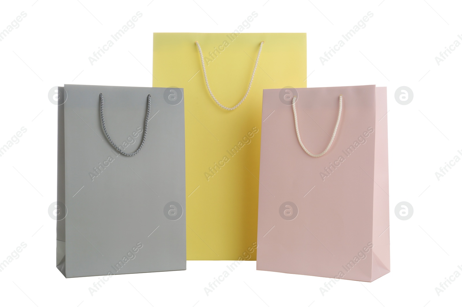 Photo of Different paper shopping bags isolated on white