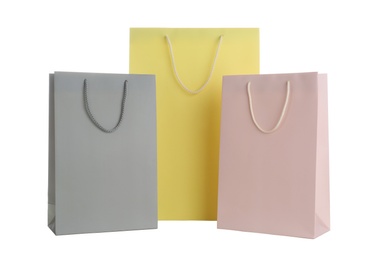 Photo of Different paper shopping bags isolated on white