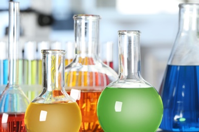 Glassware with different colorful liquids in laboratory