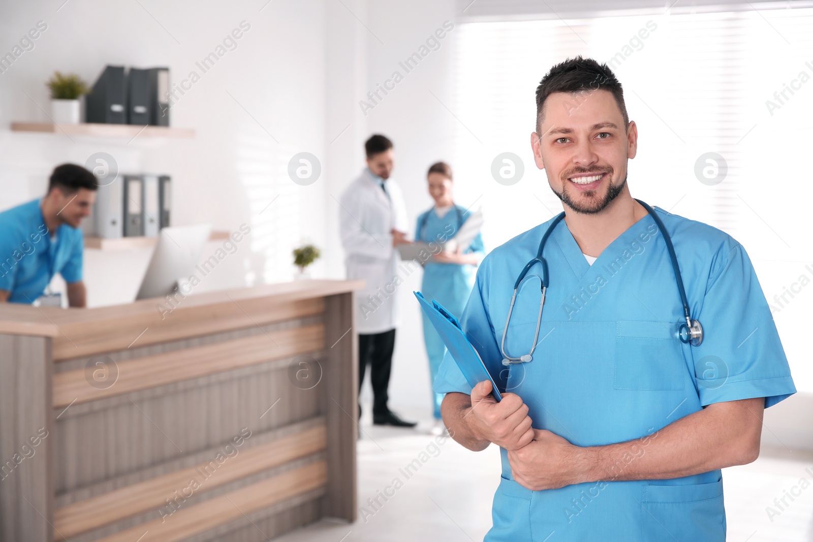 Photo of Portrait of male doctor in modern clinic