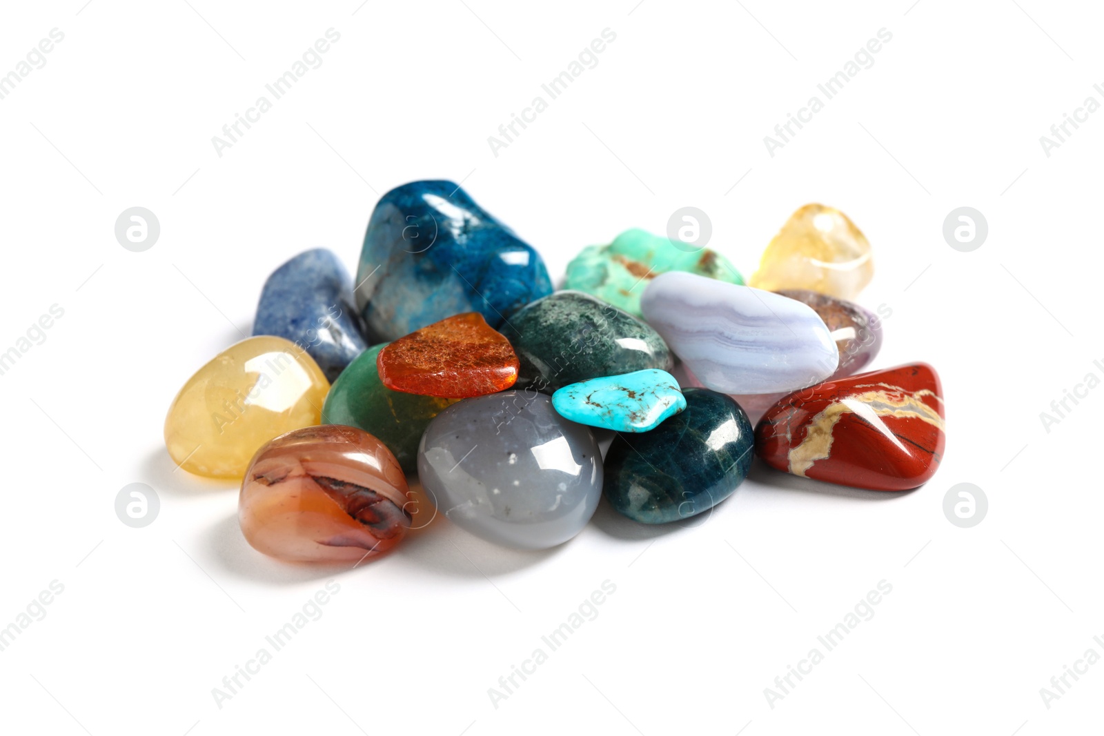 Photo of Pile of different beautiful gemstones on white background