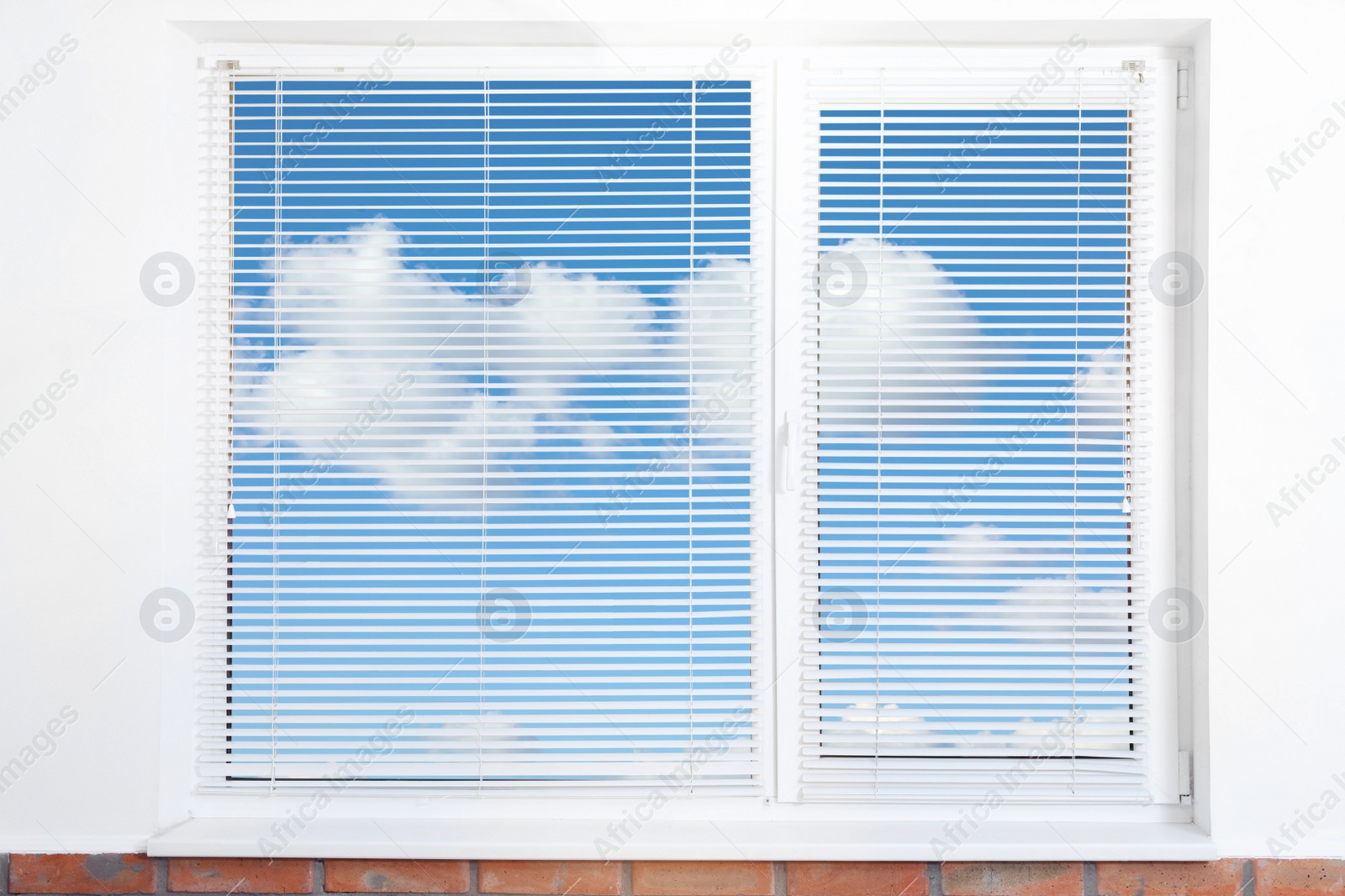 Image of Beautiful view on blue sky with clouds through window